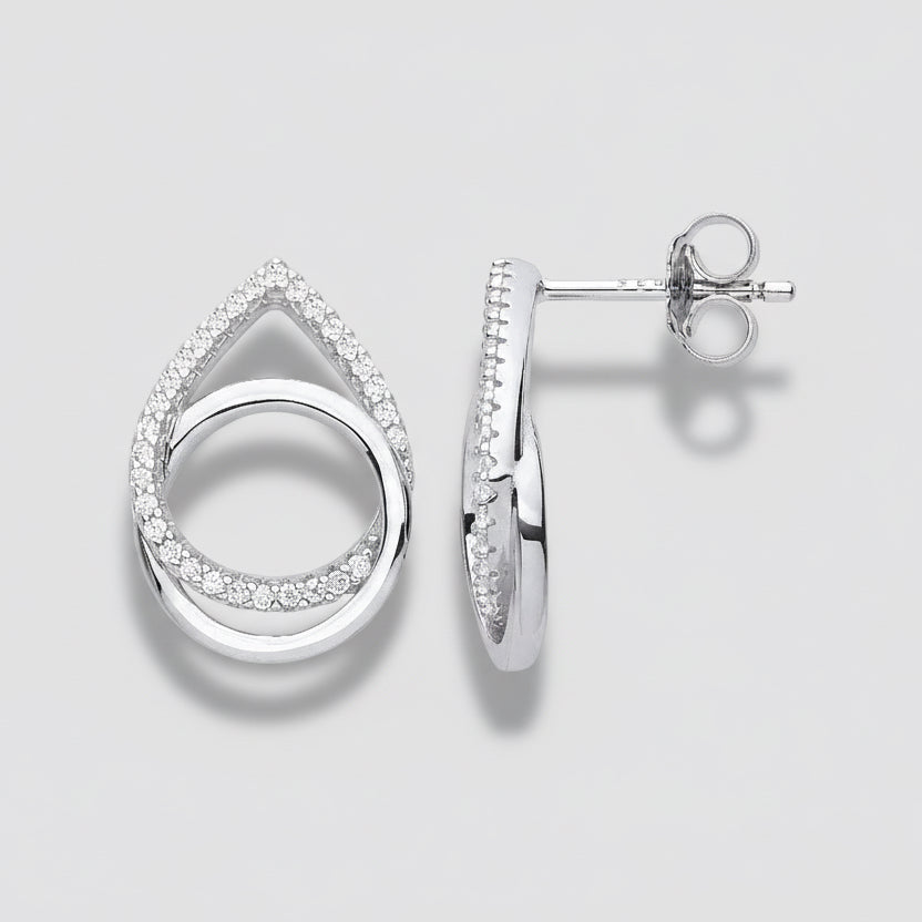 Silver earrings with clear gemstones on a white background