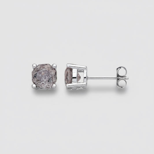 Pair of diamond stud earrings on a light gray background