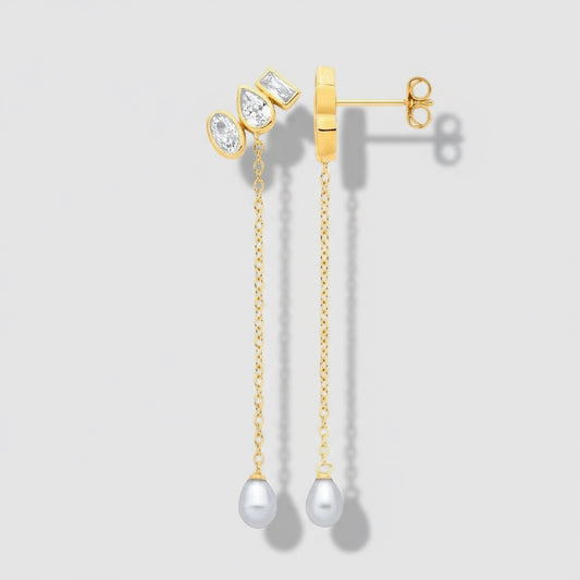 Gold earrings with pearl drops on a white background