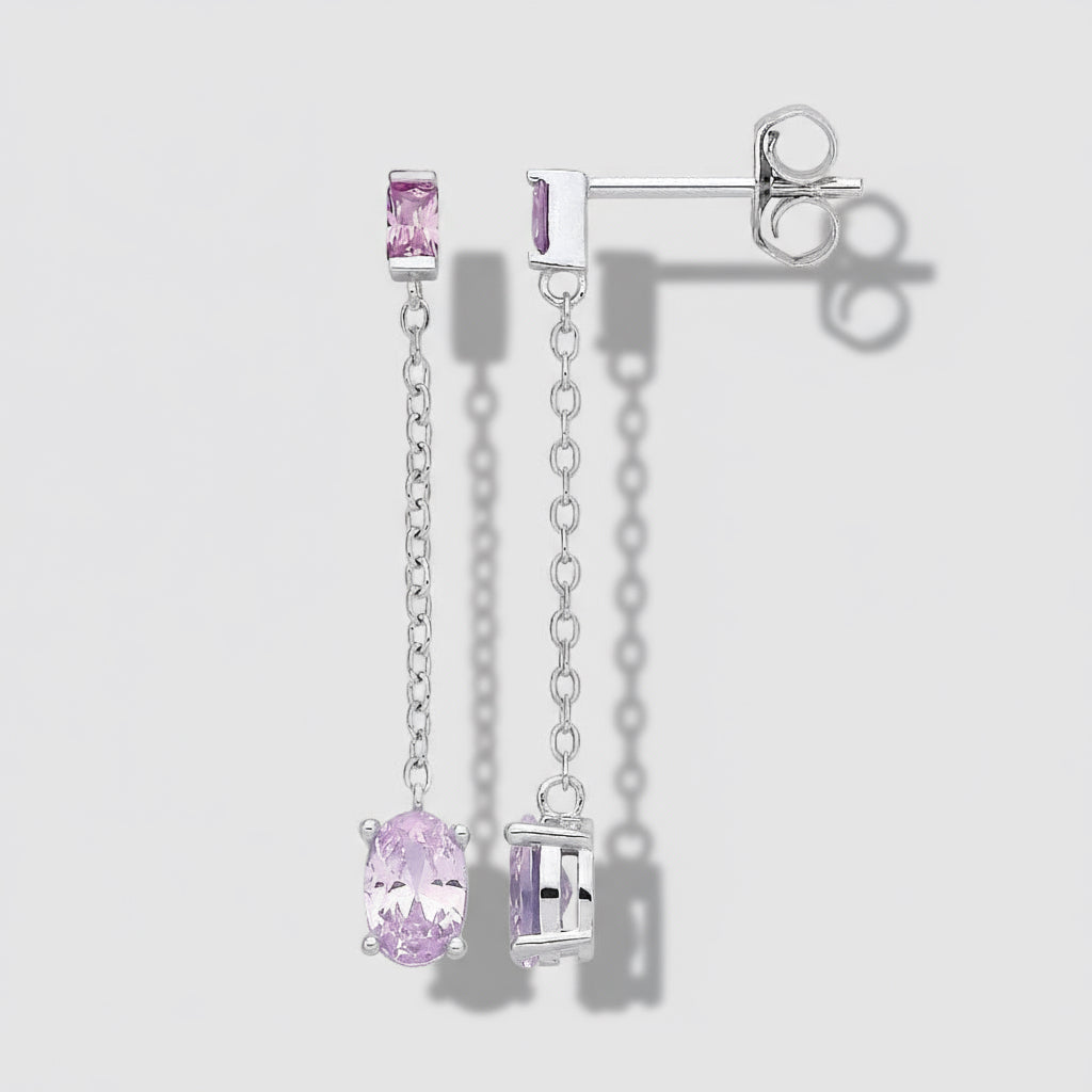 Silver earrings with pink gemstones on a white background