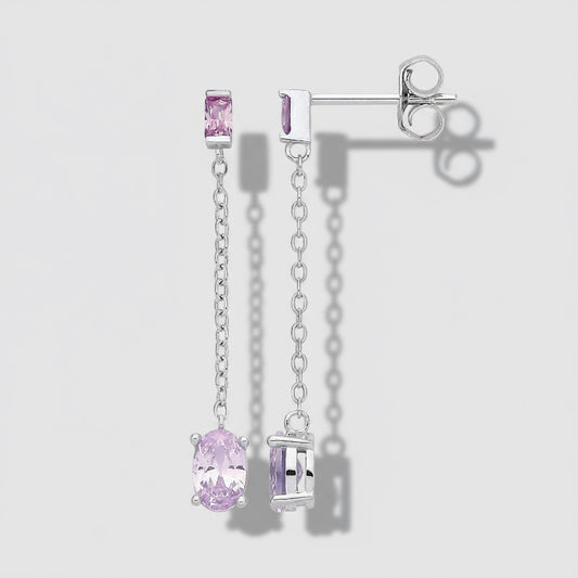 Silver earrings with pink gemstones on a white background