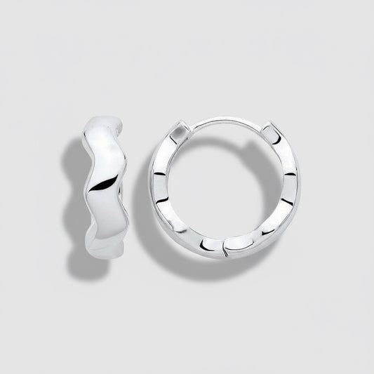 Silver hoop earrings on a white background