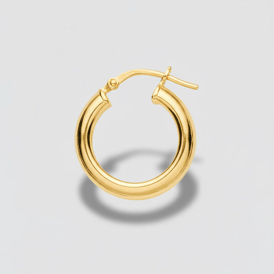 Silver hoop earring on a light gray background