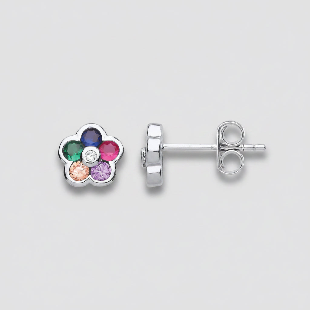 Flower-shaped earrings with colored gemstones on a white background