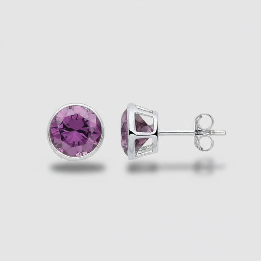 Pair of stud earrings with purple gemstones on a light gray background