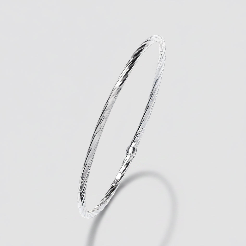 Silver bangle on a white background
