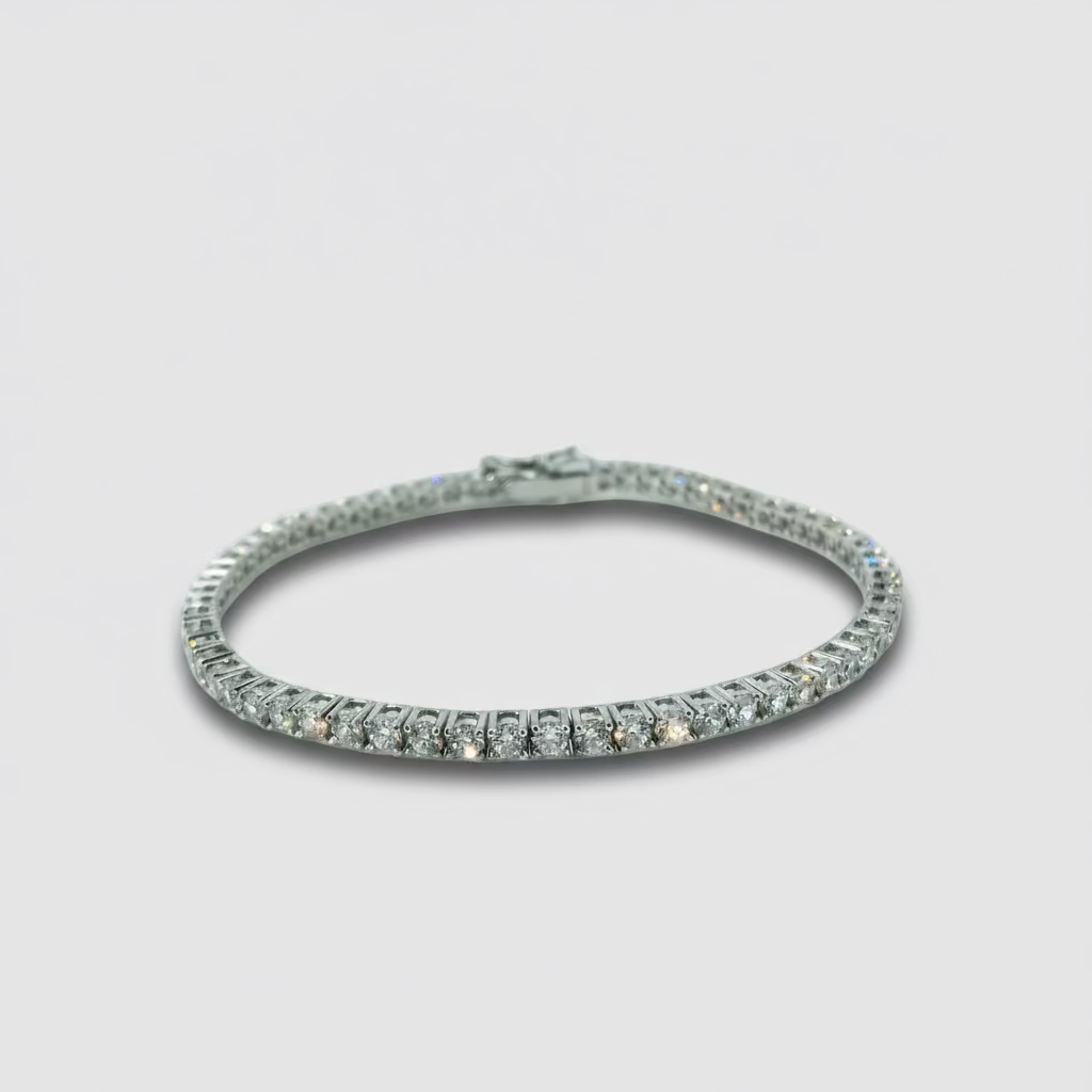 Silver bracelet with clear stones on a light gray background
