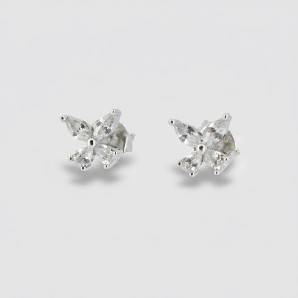 A pair of sterling silver stud earrings featuring a cubic zirconia butterfly design.