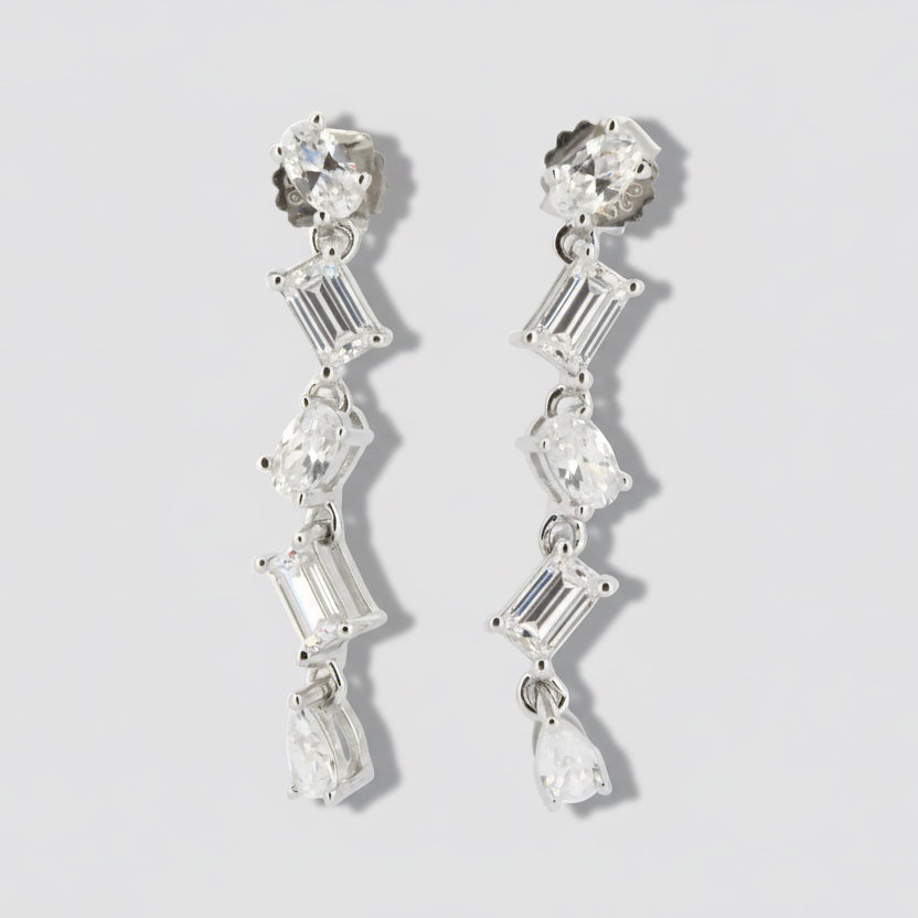 A pair of sterling silver earrings featuring multiple cubic zirconia drops.