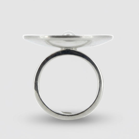 Silver ring with a flat top on a white background