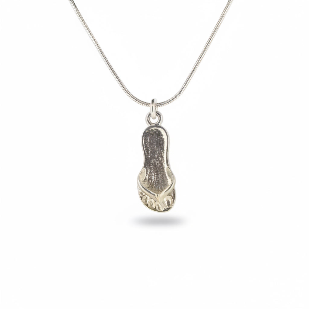 Silver flip-flop sandal pendant on a chain against a white background