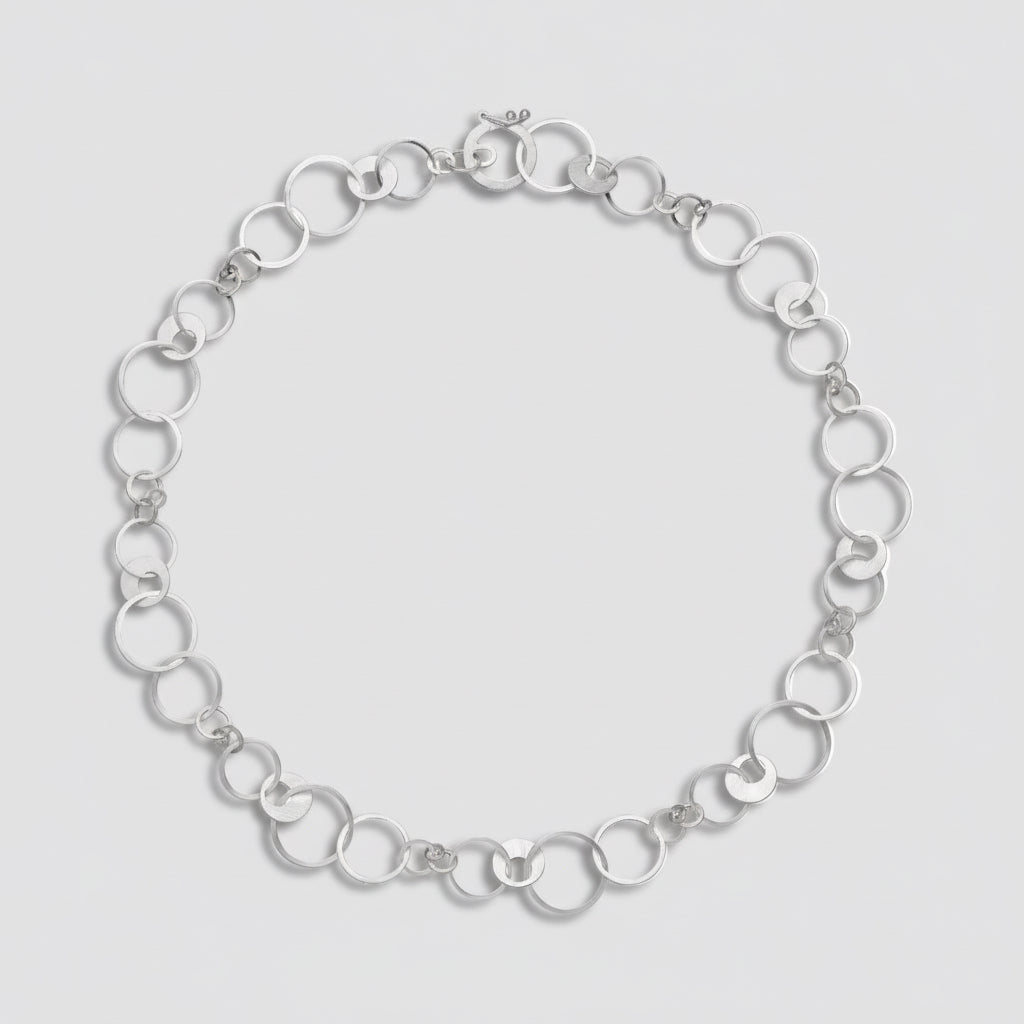 Silver chain bracelet on a white background