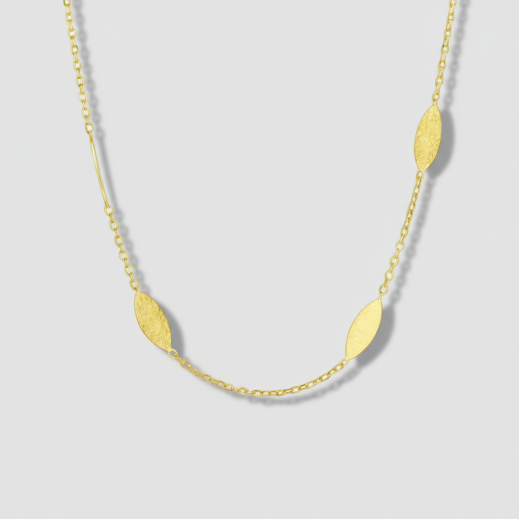 Gold necklace with leaf-shaped pendants on a white background.