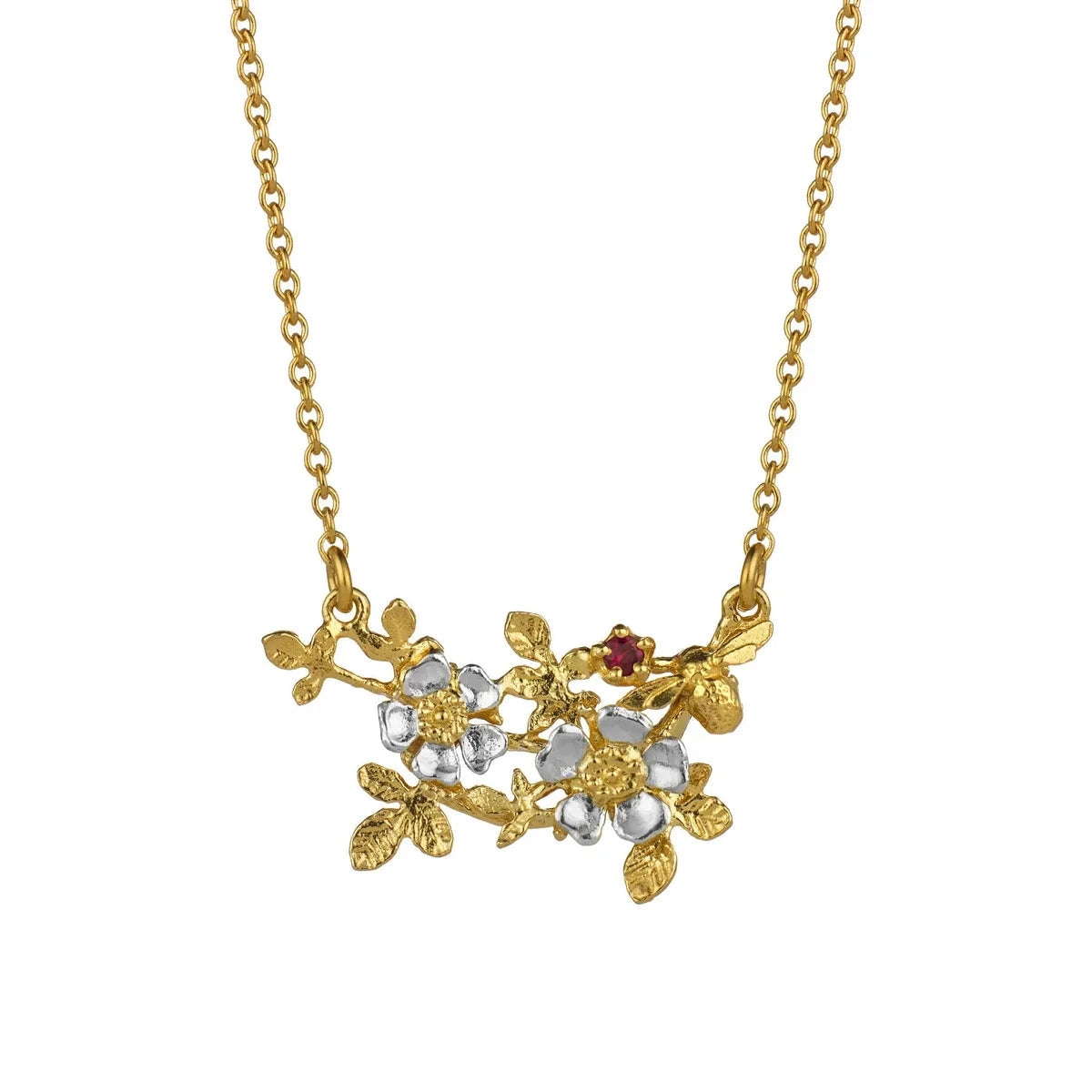 A gold chain necklace featuring a delicate pendant with gold leaves and clear faceted gemstones, accented by a small red gemstone, shown against a plain white background.