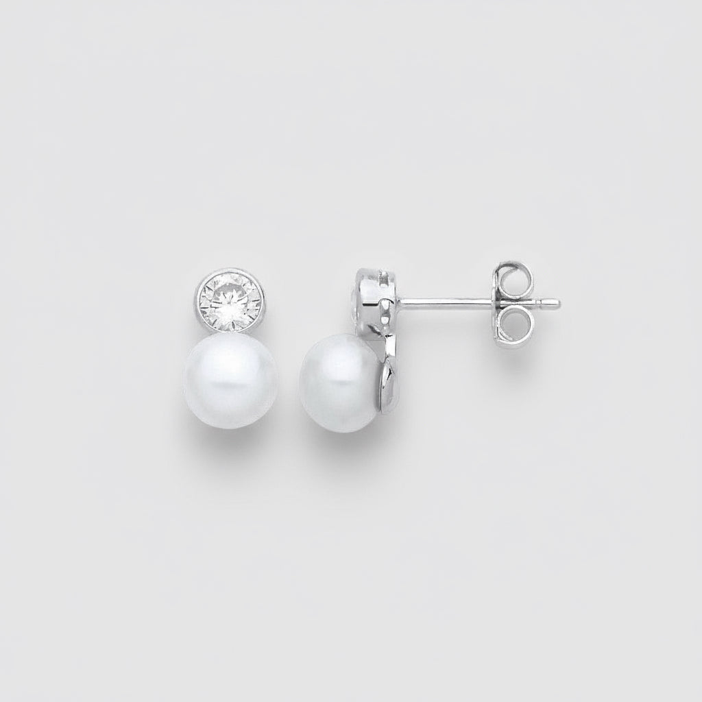Pearl earrings with a small crystal on a white background