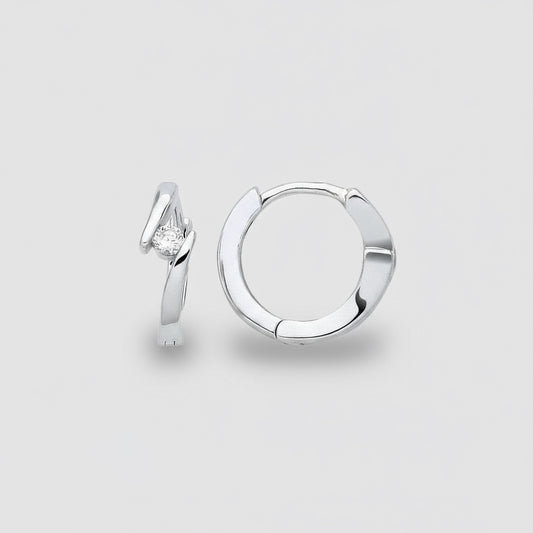 Silver hoop earring with a diamond on a light gray background