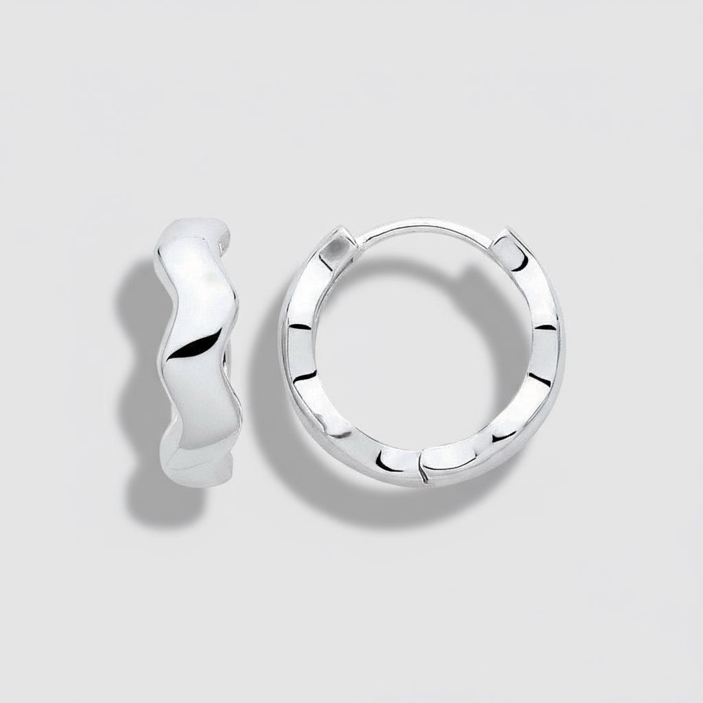 Silver hoop earrings on a white background