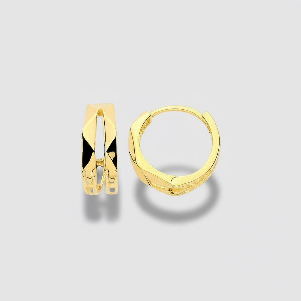 Gold hoop earrings on a white background