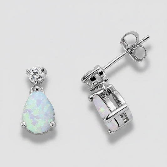 Opal teardrop earrings with silver setting on a white background