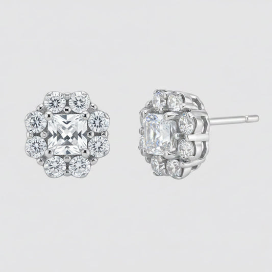 A pair of silver-toned cluster stud earrings with clear gemstones, shown from the front and side angles on a plain white background.