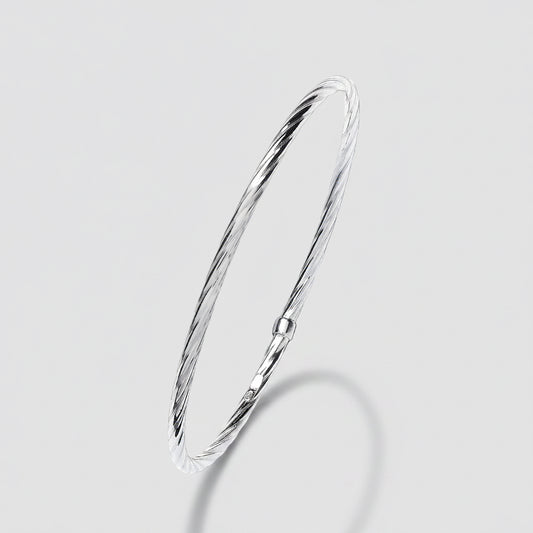 Silver bangle on a white background