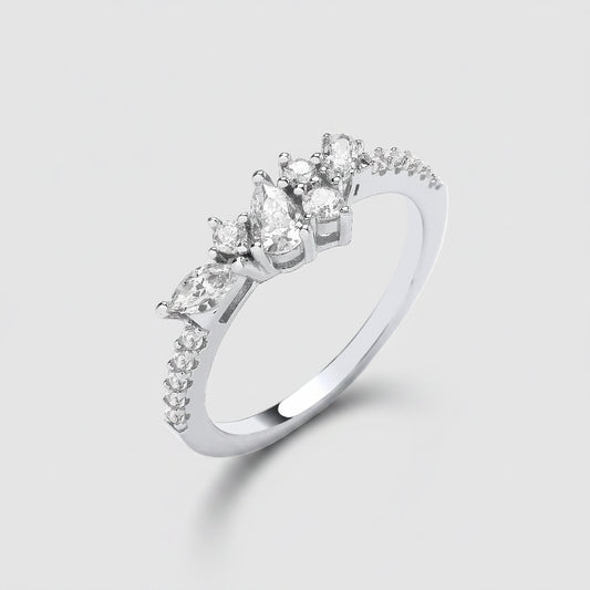 Silver ring with pear-shaped diamonds on a white background