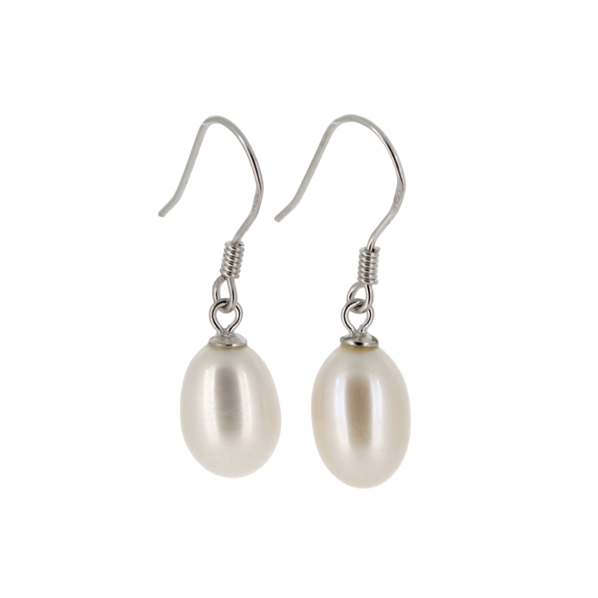 Pearl earrings with silver hooks on a light gray background