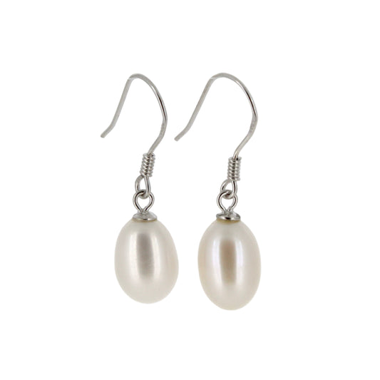 Pearl earrings with silver hooks on a light gray background