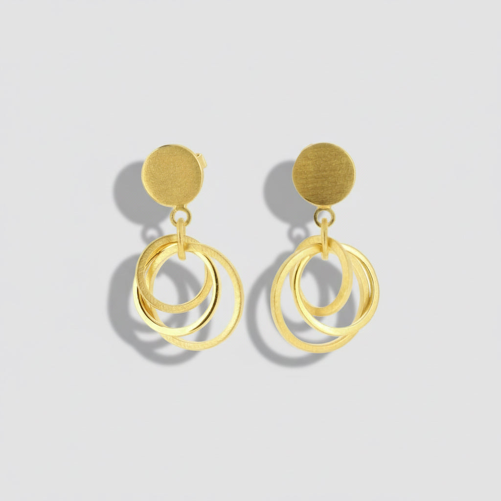 Gold hoop earrings on a white background