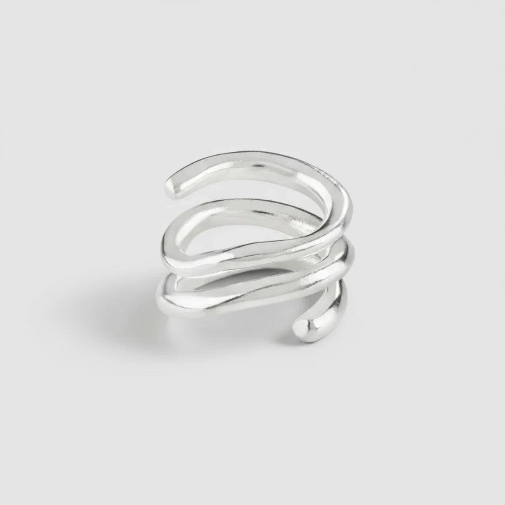 Silver spiral ring on a white background