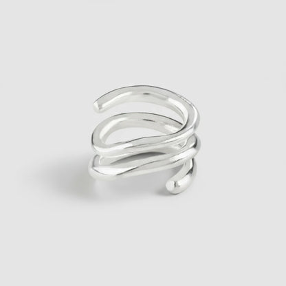Silver spiral ring on a white background