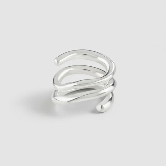 Silver spiral ring on a white background