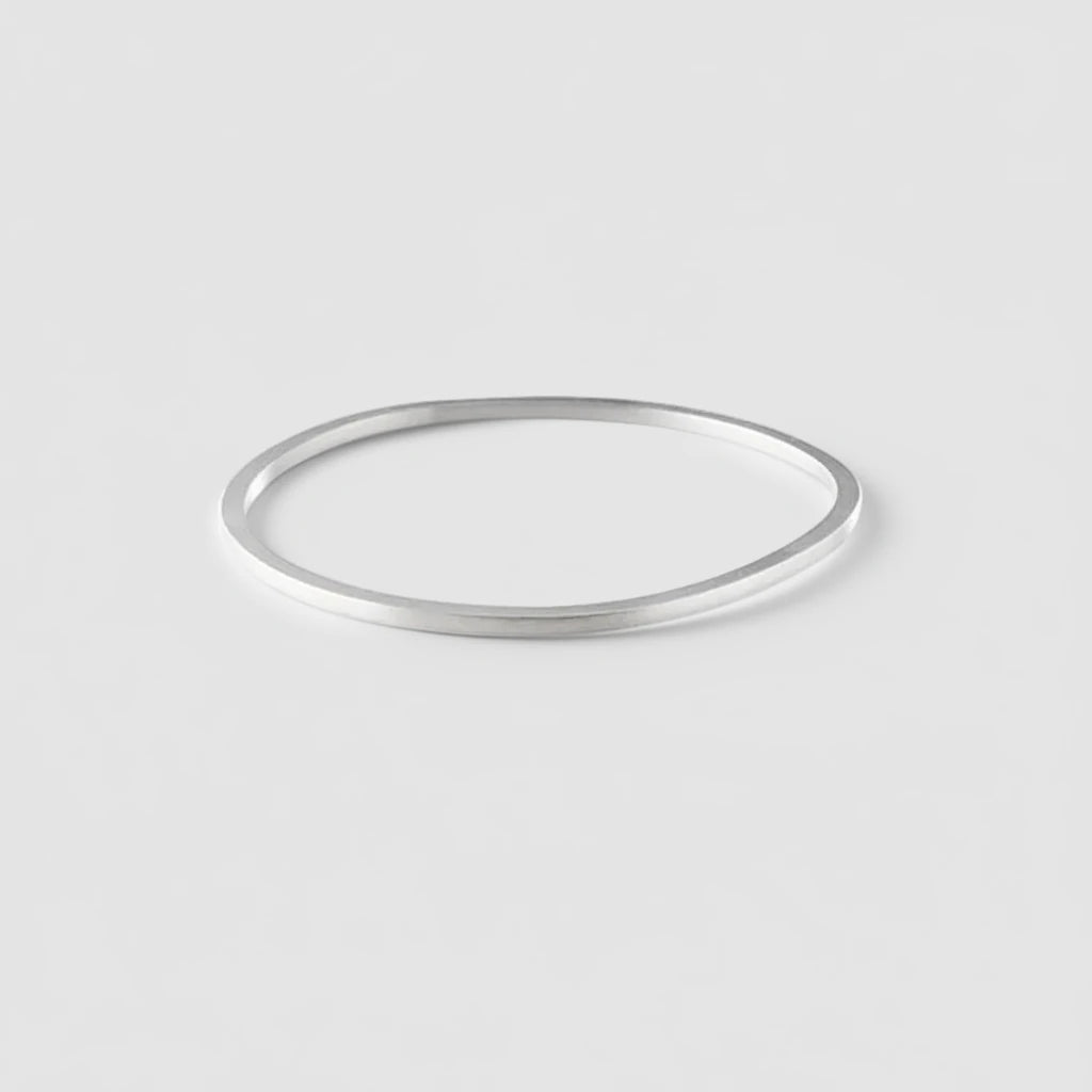 Silver bangle on a white background