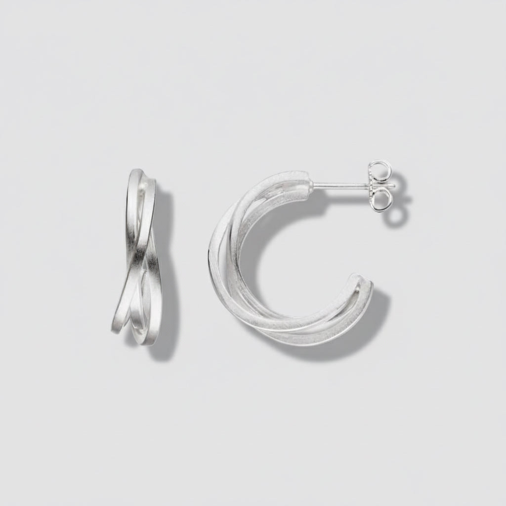 Silver hoop earrings on a white background