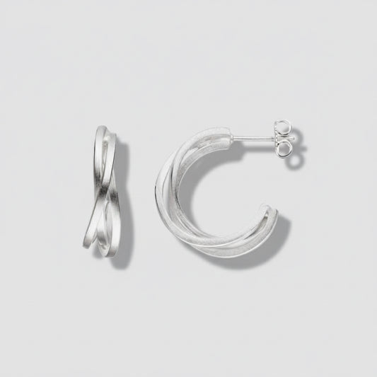 Silver hoop earrings on a white background