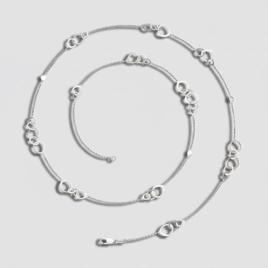 Silver chain necklace on a white background