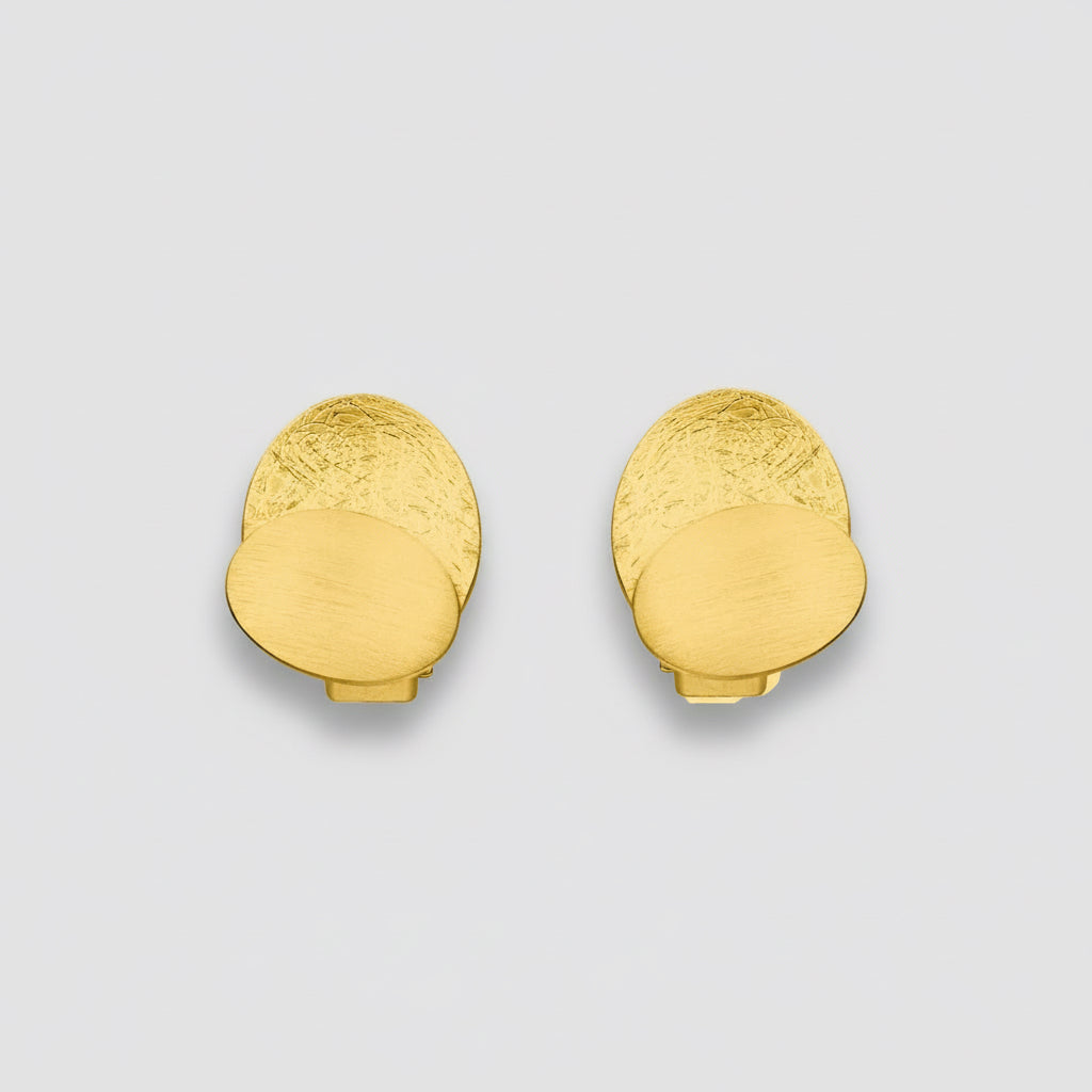 Pair of gold earrings on a white background