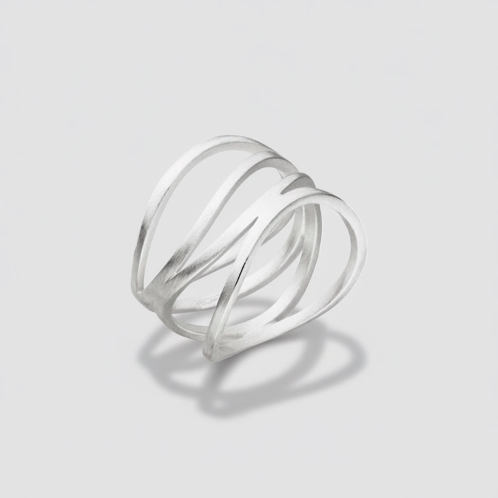 Silver ring with three intertwined loops on a white background