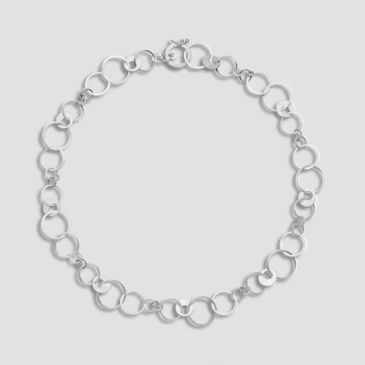 Silver chain bracelet on a white background