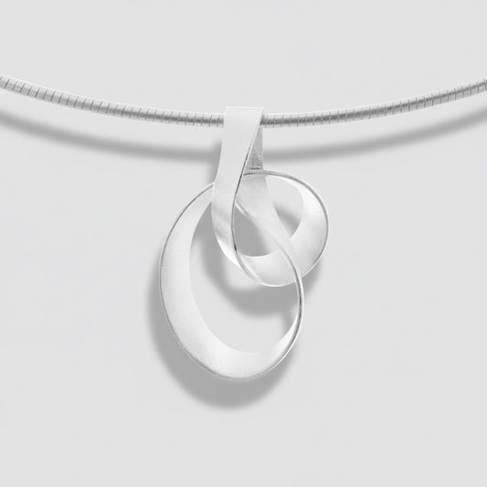 Silver necklace with a unique pendant on a white background